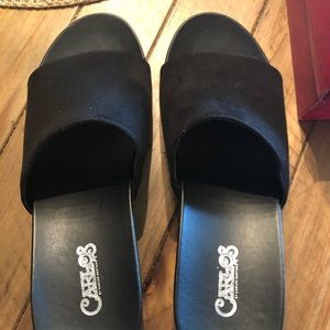 Black Carlos Santana wedge heels.